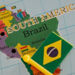 green and yellow plastic flag on the map of brazil